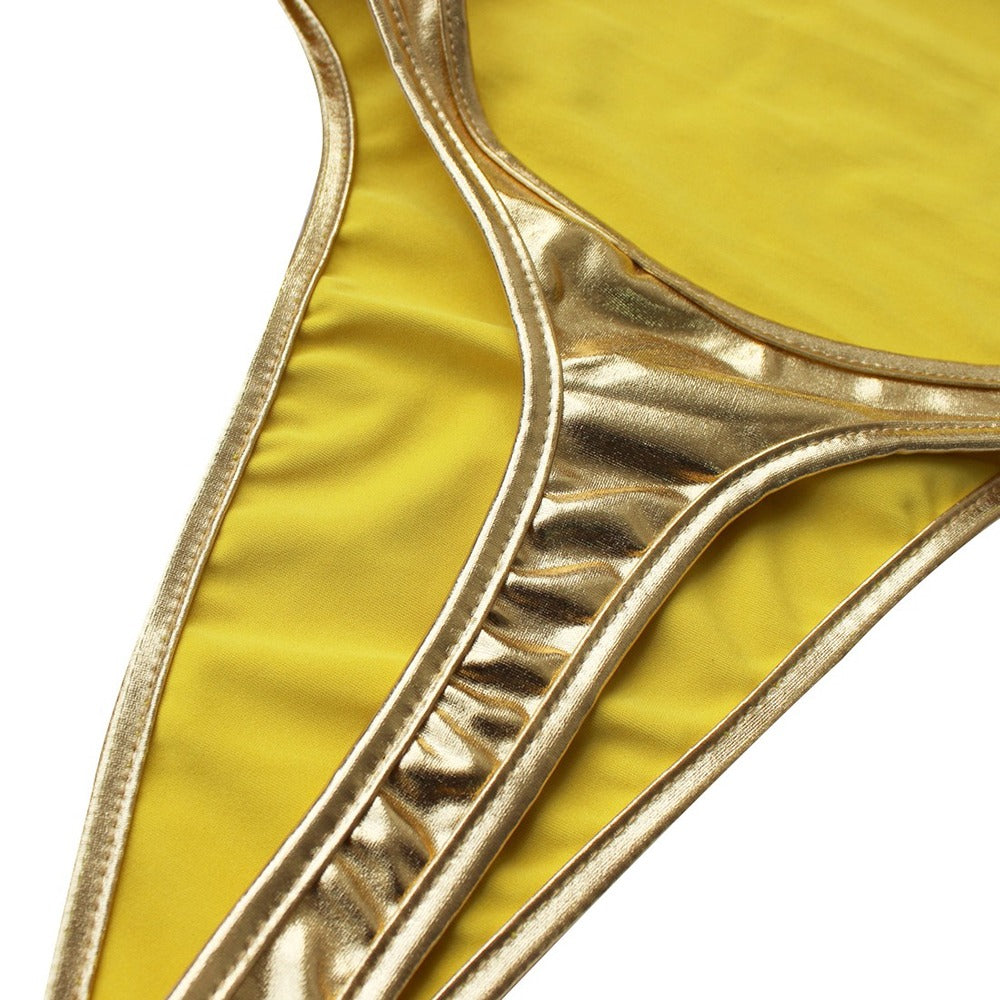 Close-up of a shiny yellow and gold thong bodysuit, perfect for sexy costumes and playful outfits.