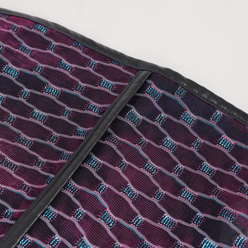 Close-up of intricate fabric pattern in vibrant purple and blue for punk style dress.
