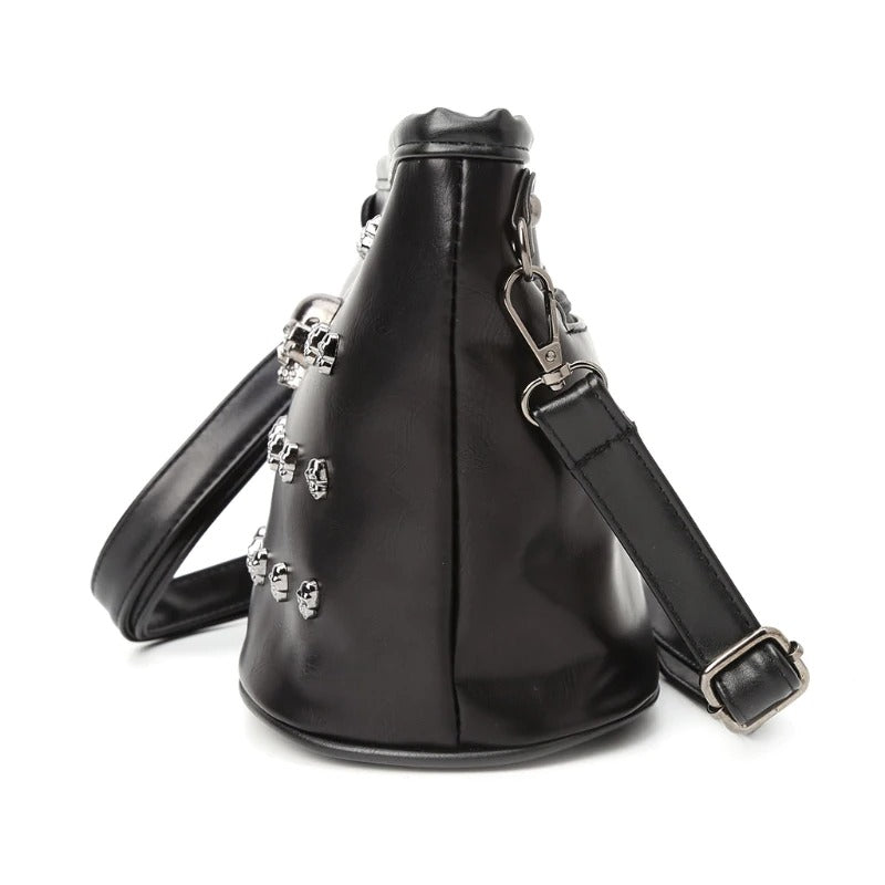 Stylish black shoulder bag with skull embellishments, perfect for edgy rock-inspired outfits for women.