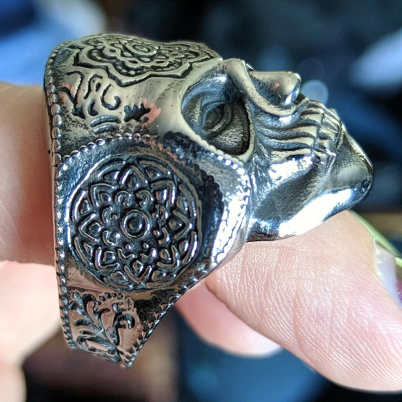 Close-up of a silver heavy sugar skull ring featuring intricate mandala designs, ideal for bikers and alternative fashion.