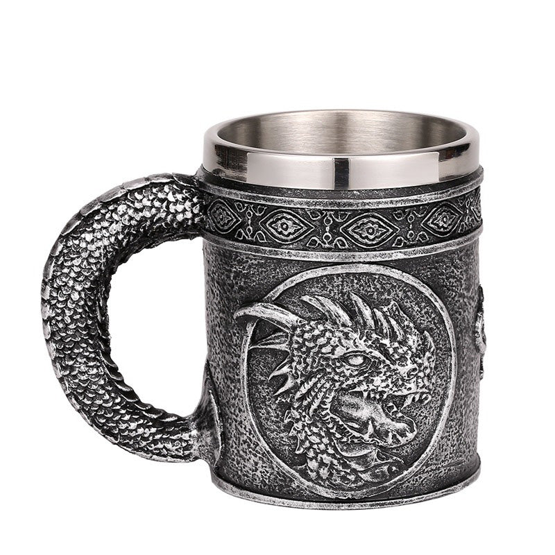 Silver resin beer mug with dragon head design, perfect for retro Viking pub lovers.