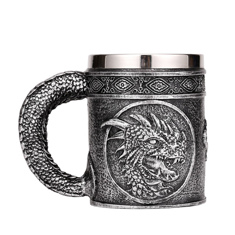 Vintage-style silver beer mug with dragon head design and stainless steel rim, perfect for Viking pub lovers.