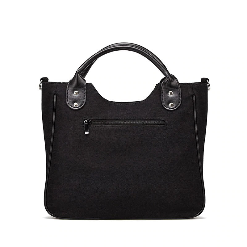 Stylish black handbag with leather accents, perfect for casual outfits and daily essentials.