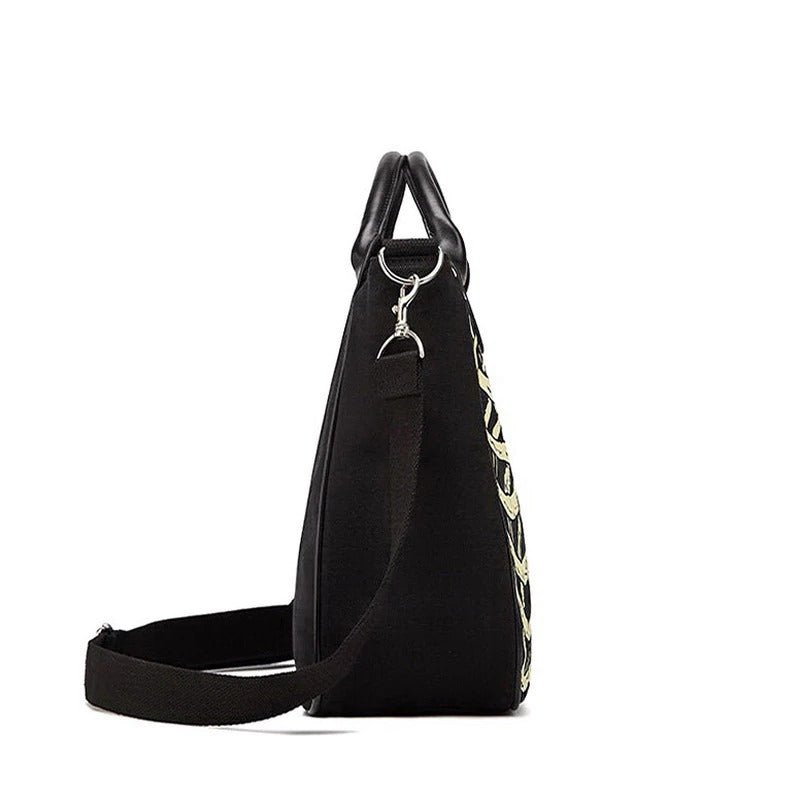 Side view of a stylish skeleton bones print handbag, perfect for grunge and alternative fashion lovers.