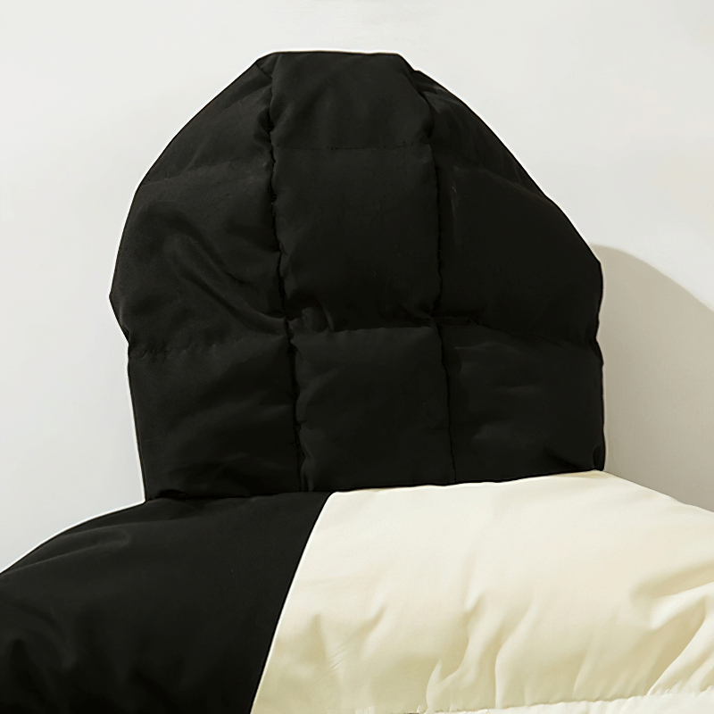 Back view of hooded skeleton print jacket showing stylish puffy hood in black and cream colors, perfect for punk fashion.