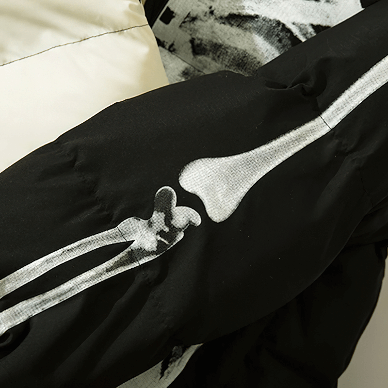 Close-up of a skeleton print on the sleeve of a stylish hooded jacket for punk fashion enthusiasts.