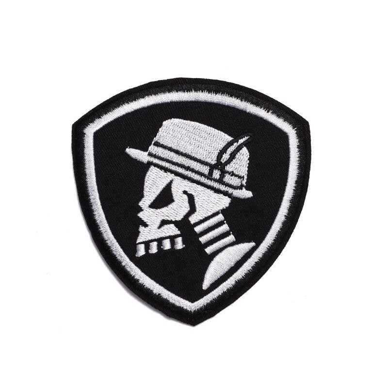 Skull and hat fusible patch on a black shield background, perfect for jackets and bags.