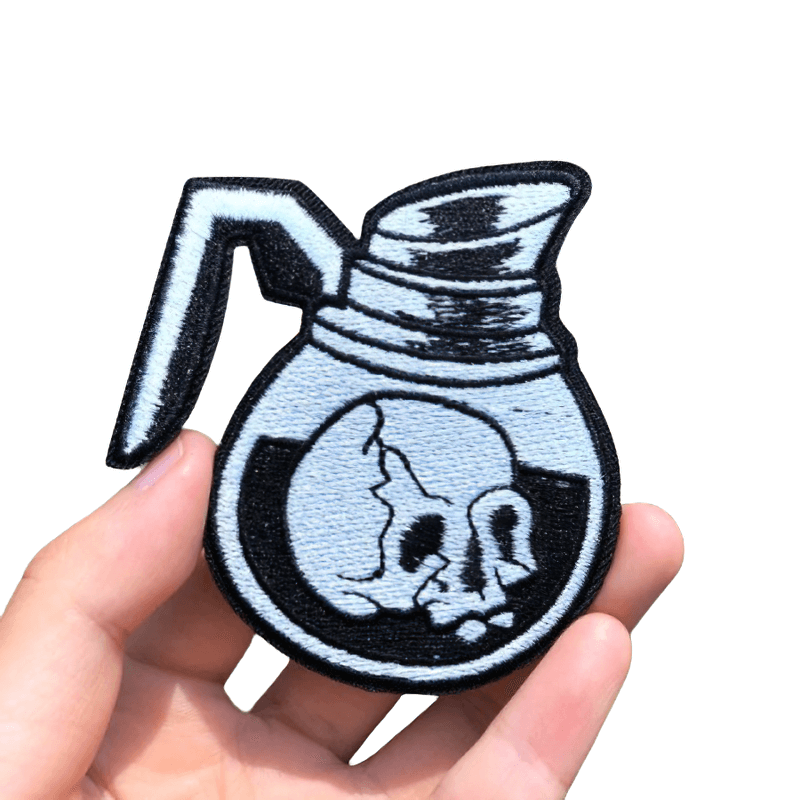 Stylish skull coffee pot patch in gothic style, perfect for unisex rock fashion accessory.