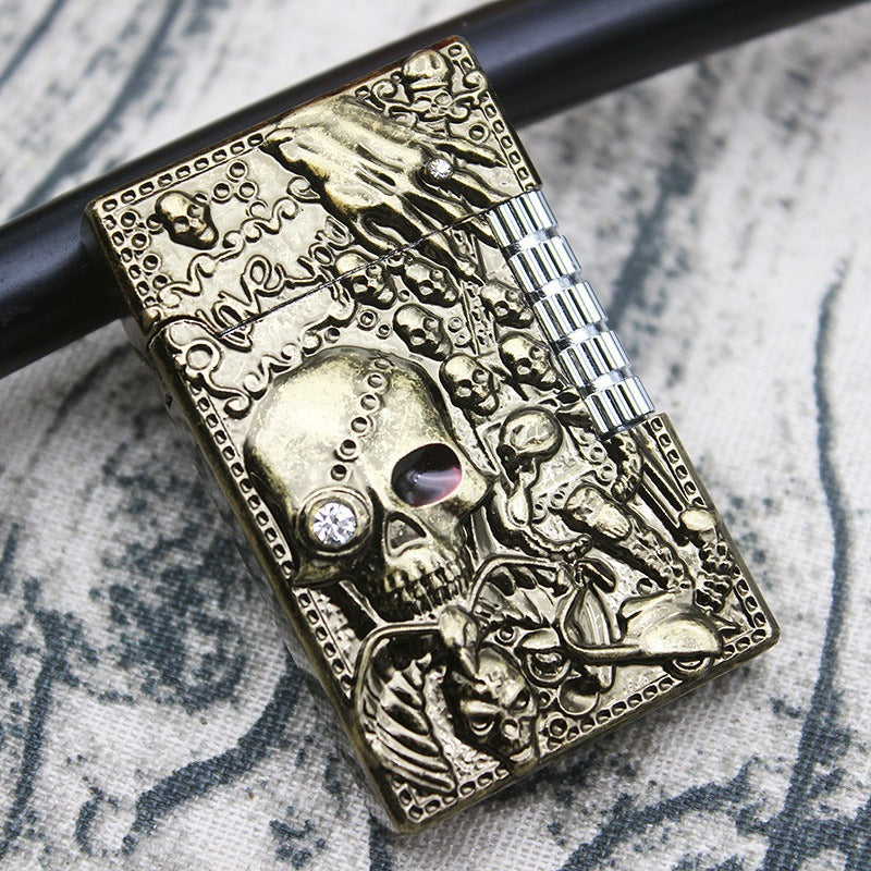 Skull gas lighter with intricate metal design, featuring skulls and rock-inspired embellishments, perfect for heavy metal fashion.