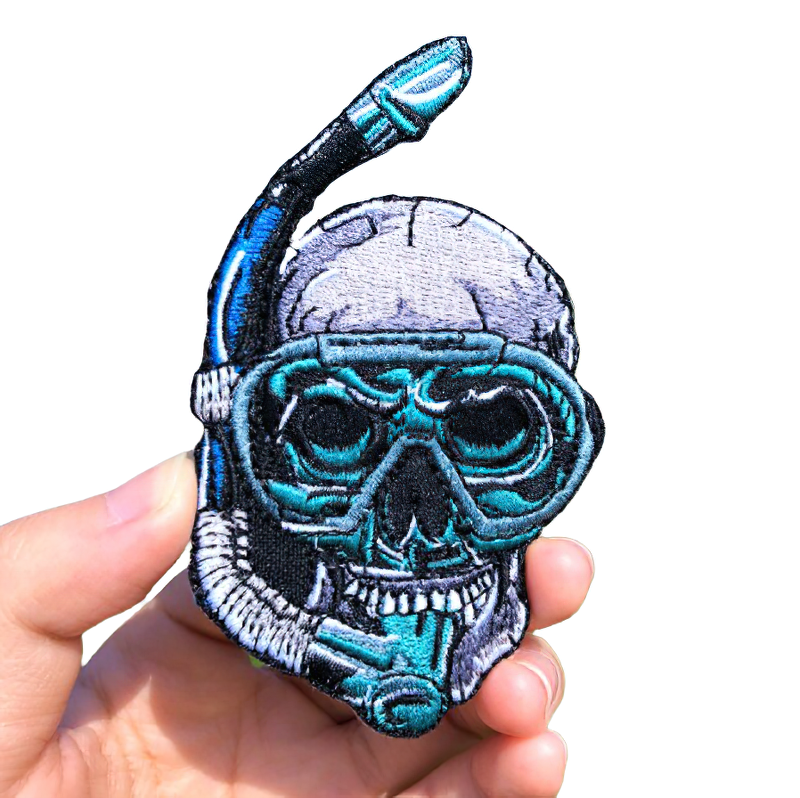Gothic skull patch in an underwater mask, a stylish unisex accessory for alternative fashion lovers.