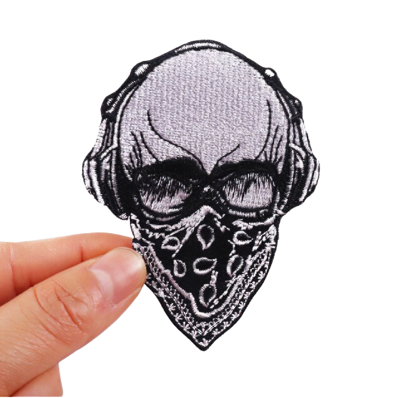 Skull in bandage with headphones patch for jackets and bags, stylish unisex rock accessory, quality embroidered design.
