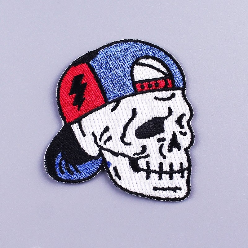 Skull patch in blue baseball cap, perfect for jackets and bags, adding a stylish rock vibe to your outfits.