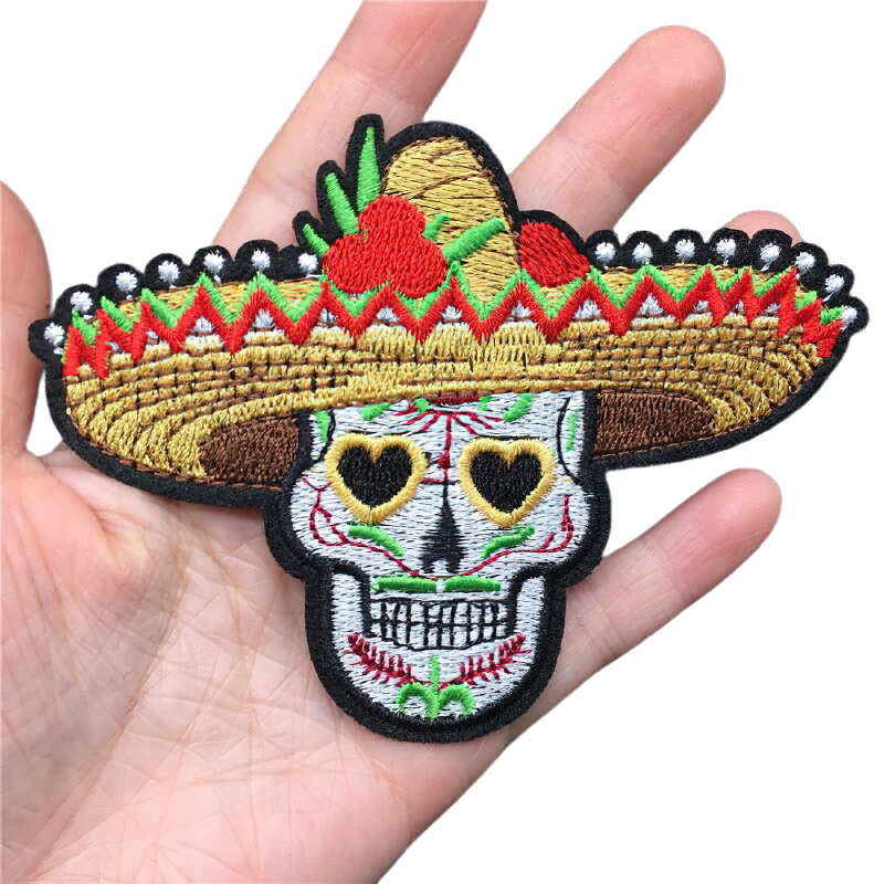 Gothic skull patch in a Mexican hat, colorful embroidered badge for clothes and accessories, unisex fashion.