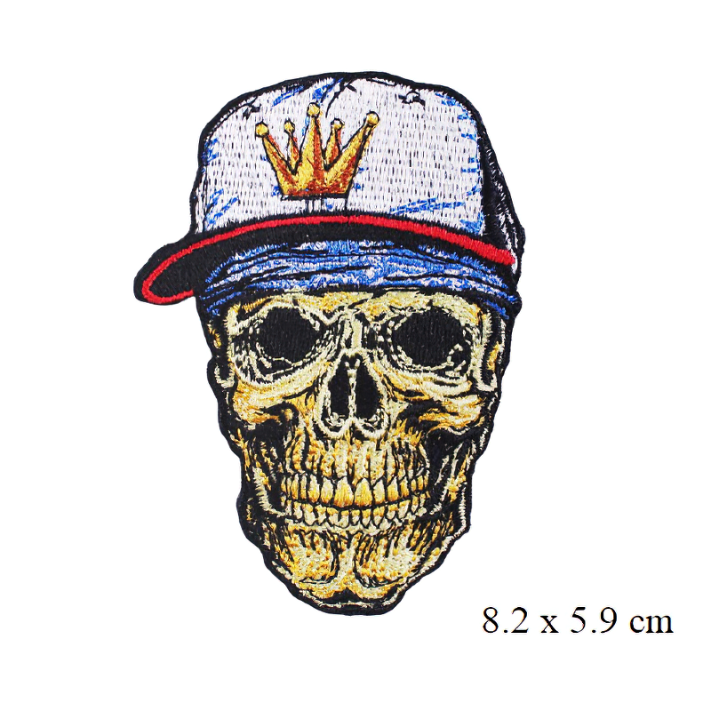 Stylish skull patch with cap, perfect for gothic fashion and unisex clothing accessories. Quality embroidery detail.