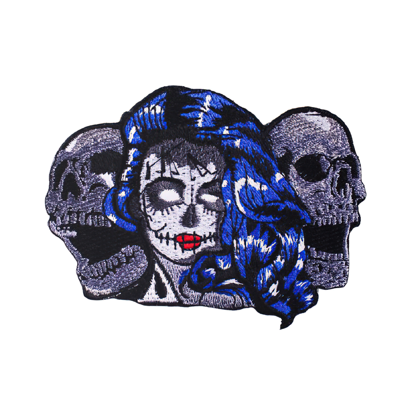 Unisex skull patch featuring a vibrant design with skulls and a blue-haired figure, perfect for alternative fashion on jackets and bags.