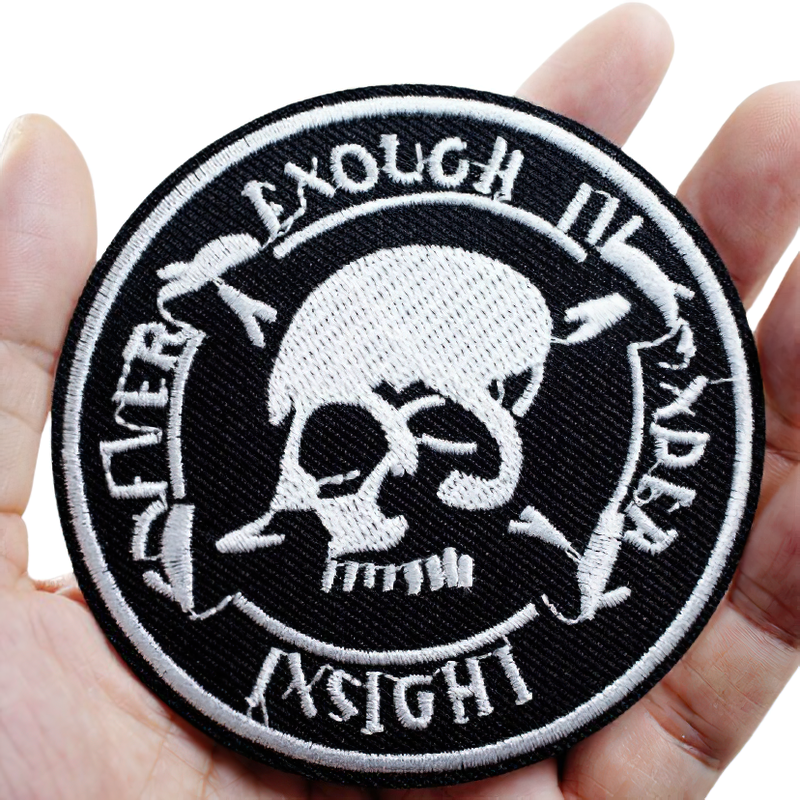 Unisex black skull patch displayed in hand, perfect for rock style clothing and gothic fashion accessories.