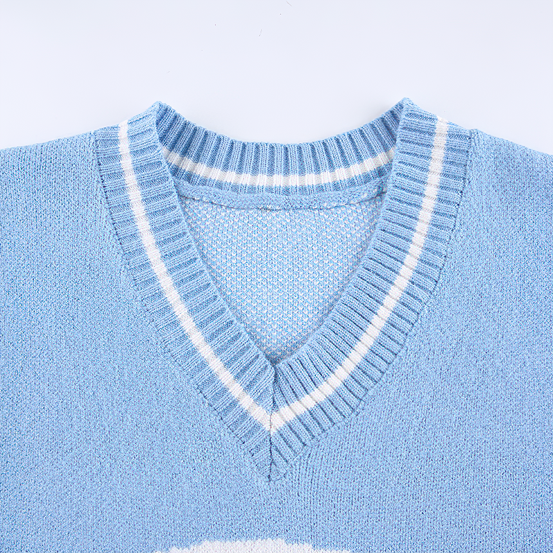Close-up of a blue V-neck pullover with white stripes, part of stylish skull print women's tops.