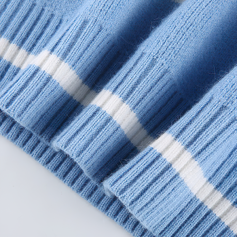 Close-up of blue acrylic fabric with white stripes, perfect for a stylish summer pullover.