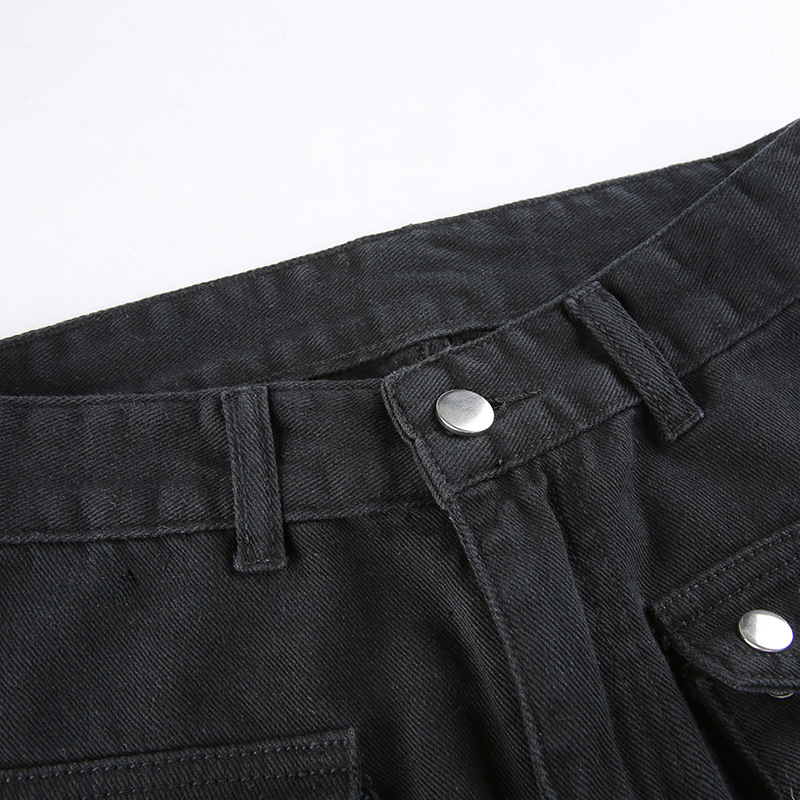 Close-up of women's black gothic buckle pants showing waistband details and silver fittings.