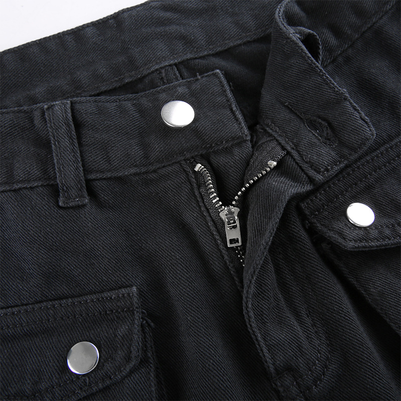 Close-up of black buckle pants zipper and pockets, showcasing gothic style and trendy design.