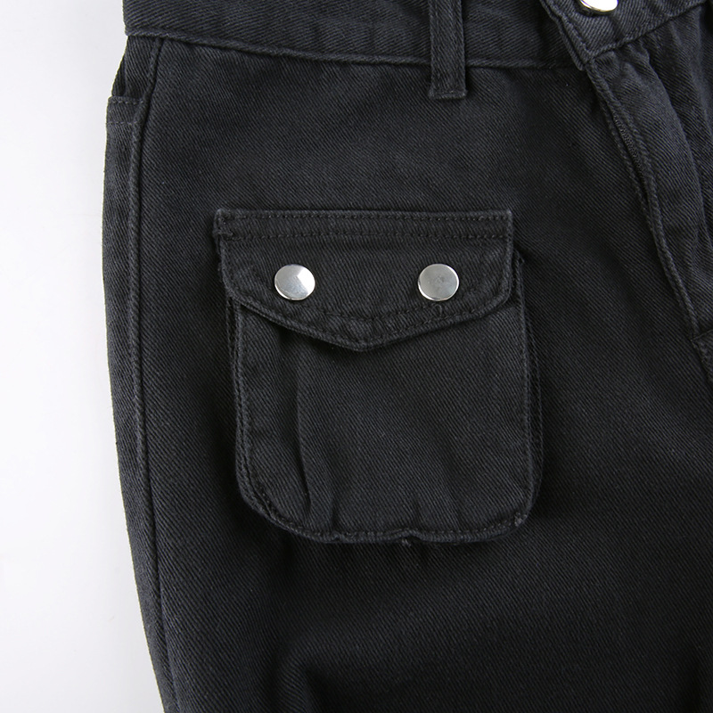 Close-up of a black buckled women's pant pocket with silver snaps, showcasing gothic style fashion.