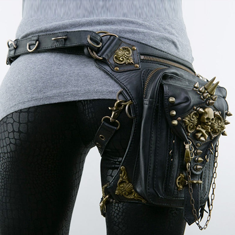 Gothic steampunk shoulder bag with bronze skull and spikes, ideal for rockers and bikers, showcasing unique retro style.