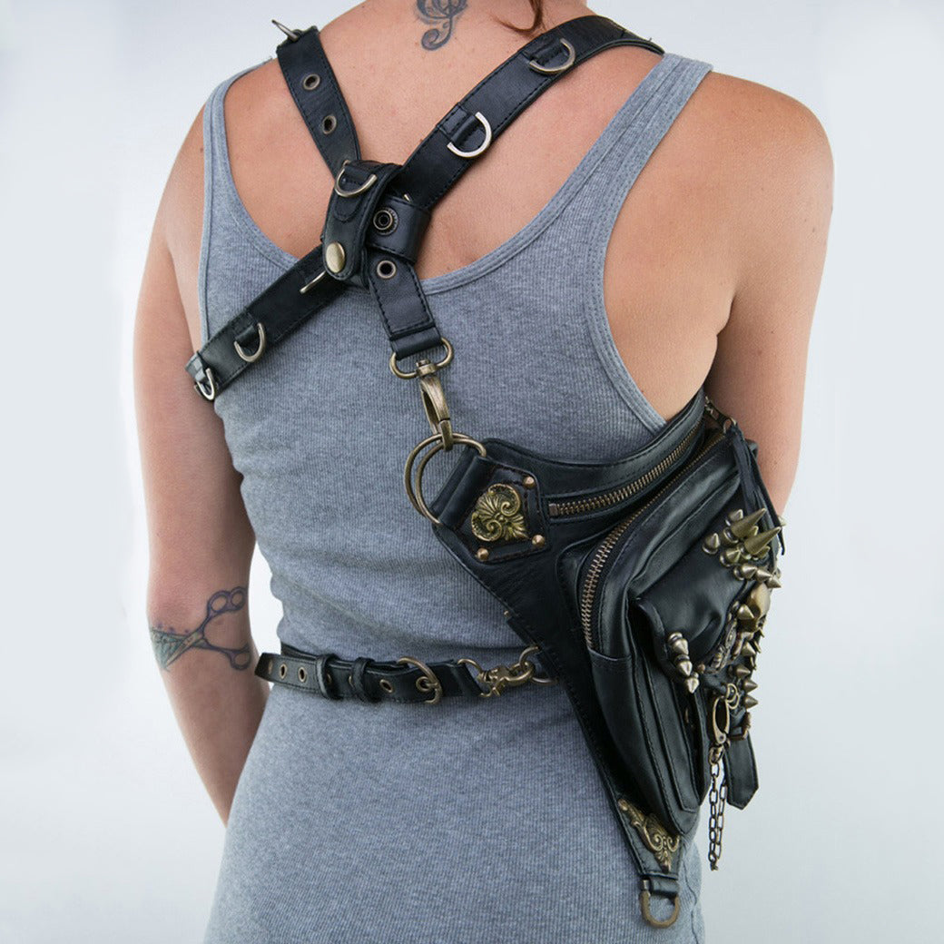 Gothic steampunk skull bag worn as a stylish drop leg accessory on a grey tank top.