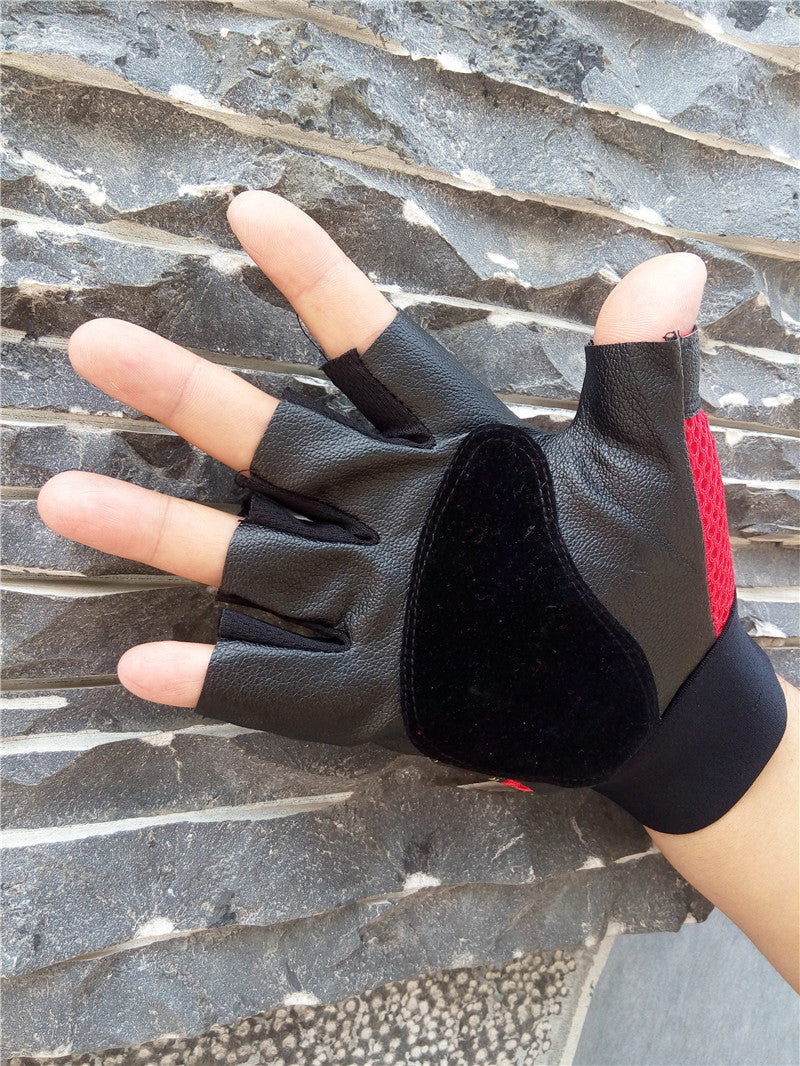 Black half finger gloves with red accents, featuring a pirate skull design and rivets for edgy alternative fashion.