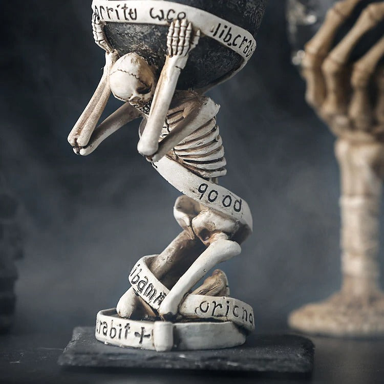 Unique slave skull wine glass featuring a skeleton holding it up, perfect for vintage-themed bars or home collections.
