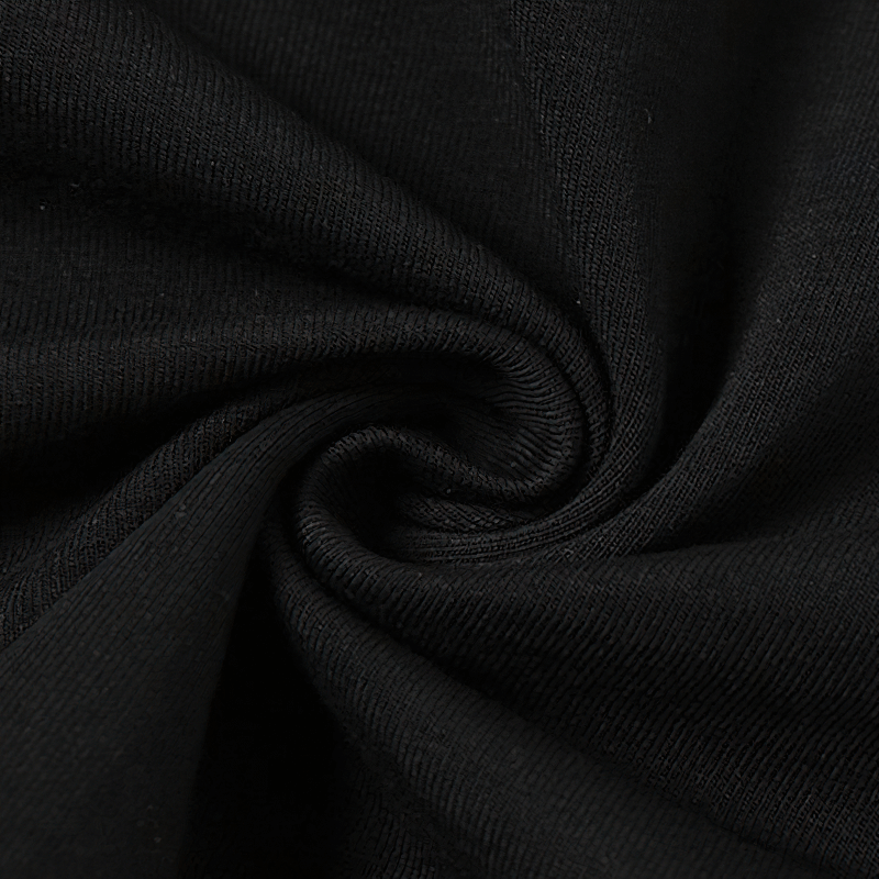 Close-up view of soft black fabric, showcasing the smooth texture and quality of the material used in the two-piece set.