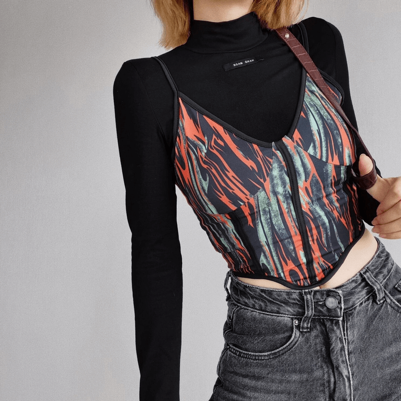 Stylish slim fit multicolor cami top layered over a black turtleneck, paired with high-waisted jeans for a trendy look.
