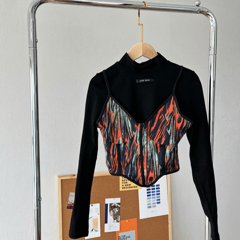 Stylish multicolor short cami top and black sweatshirt on hanger showcasing a trendy two-piece set for women.