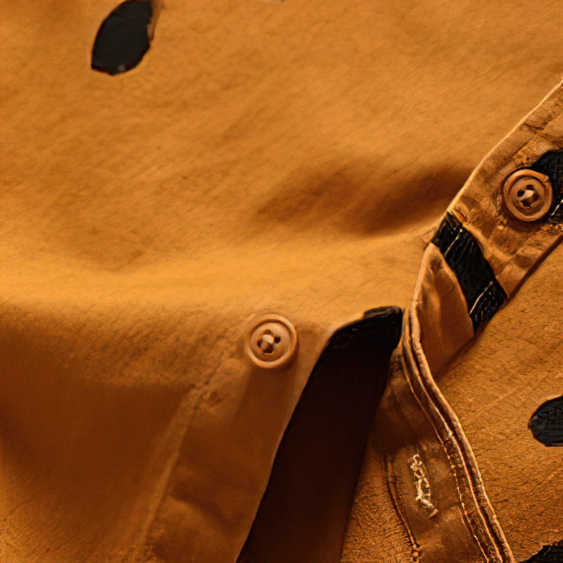 Smiley print cotton shirt detail in warm orange with buttons and soft fabric for trendy casual style.