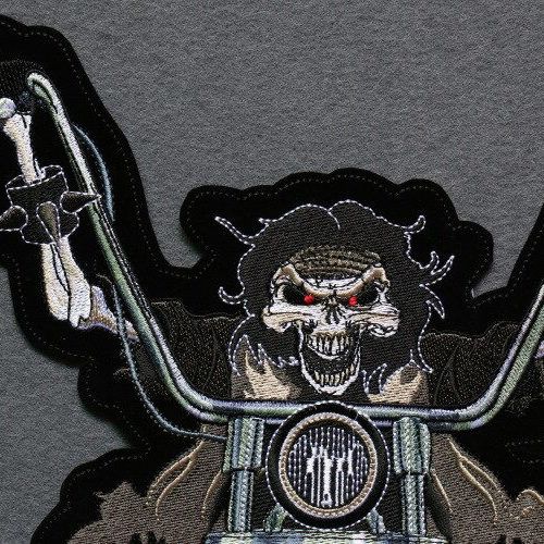 Smiling skeleton iron-on biker patch for jackets, featuring a fierce design and colorful embroidered details.