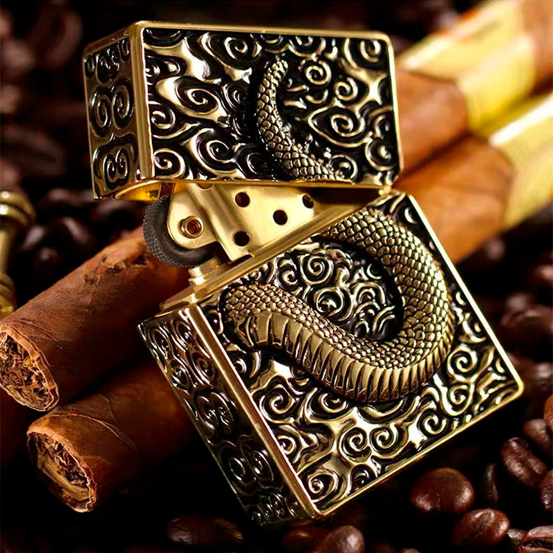 Snake design gasoline lighter with metallic relief, stylish smoker's gadget on a background of cigars and coffee beans.