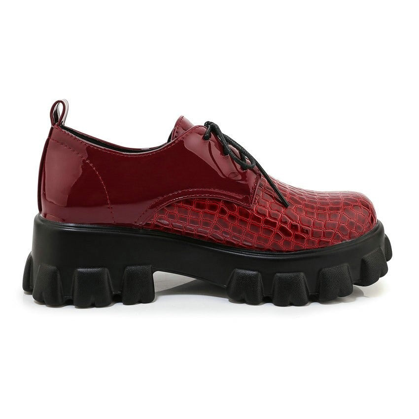 Red snake pattern PU leather pumps with high block heels and lace-up design, perfect for stylish rock looks.