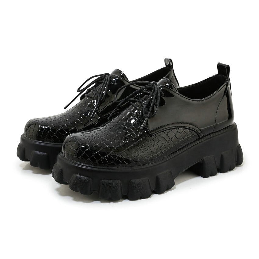 Black snake pattern PU leather pumps with high chunky soles and lace-up design for stylish women's footwear.