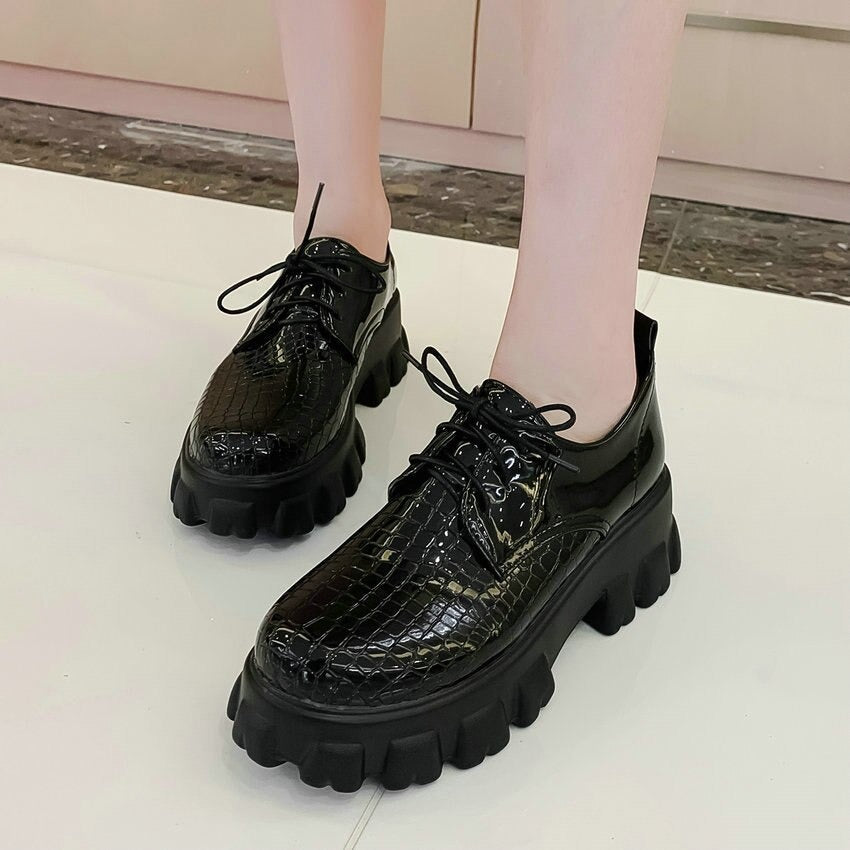 Black snake pattern PU leather lace-up pumps with chunky sole, stylish and trendy women's footwear.