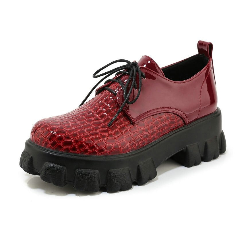 Red snake pattern PU leather pumps with high chunky soles and lace-up design, perfect for a stylish rock look.