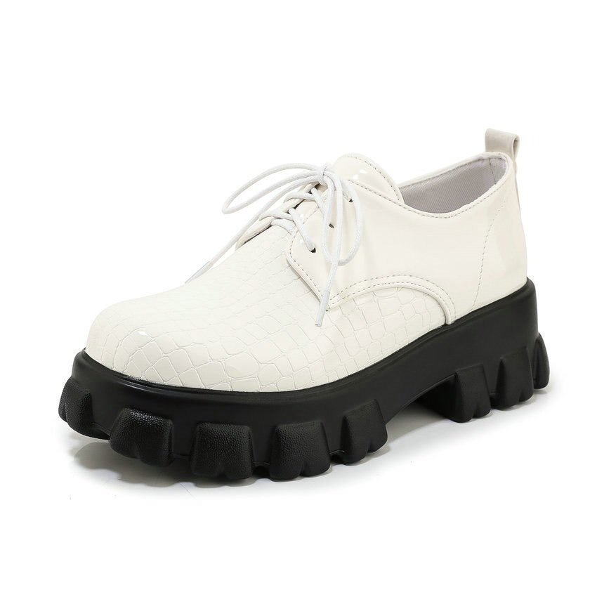 Stylish white snake pattern PU leather women pumps with chunky black sole and lace-up design.