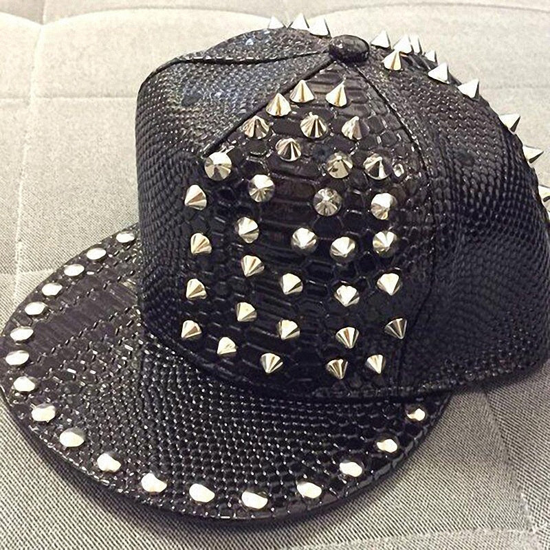 Faux leather snakeskin cap with studs and spikes for a punk rock style look.