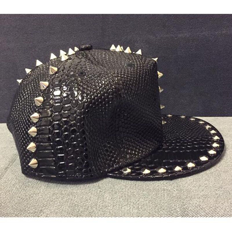 Faux leather snakeskin baseball cap with studs and spikes for edgy punk styling.