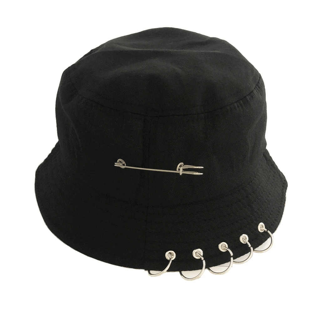 Unisex solid color cotton bucket hat featuring punk style pin rings and a safety pin detail for a trendy look.