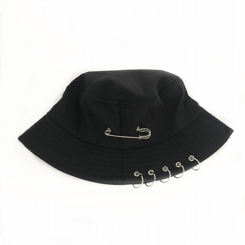 Unisex black cotton bucket hat with punk style pin rings and safety pin accessory for a trendy look.