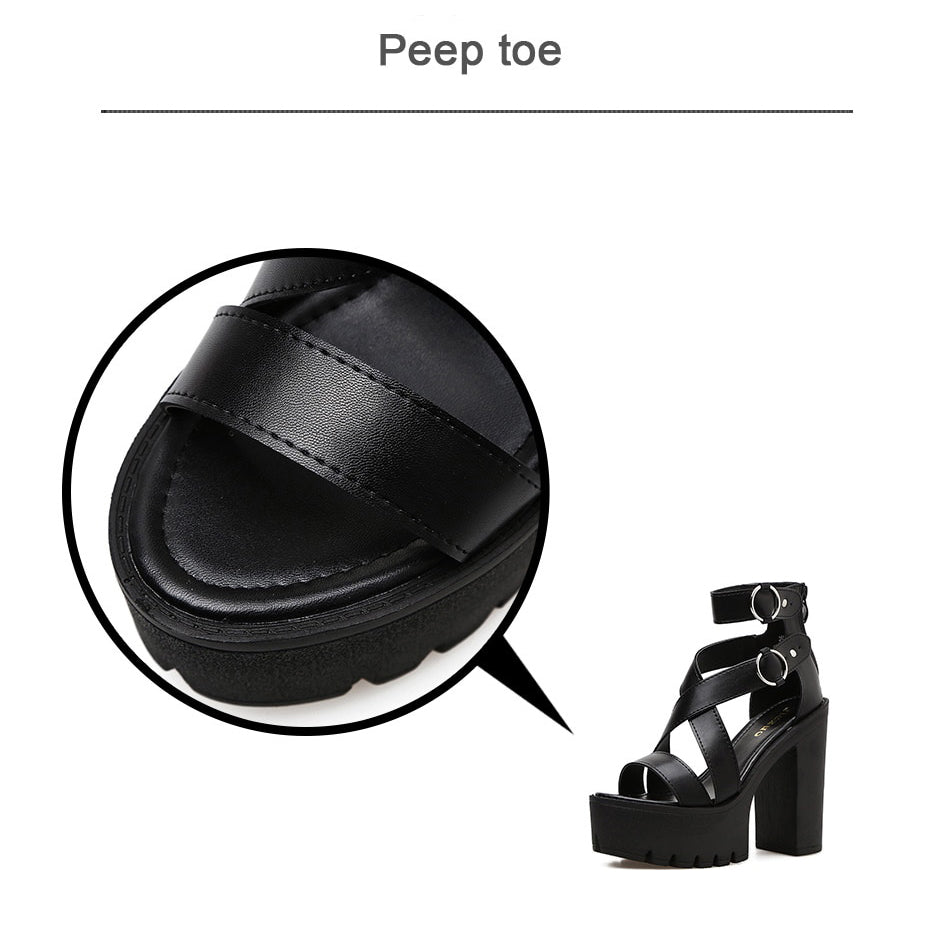 Close-up of peep toe black gladiator sandals with buckles and high heels, showcasing the stylish Gothic design.