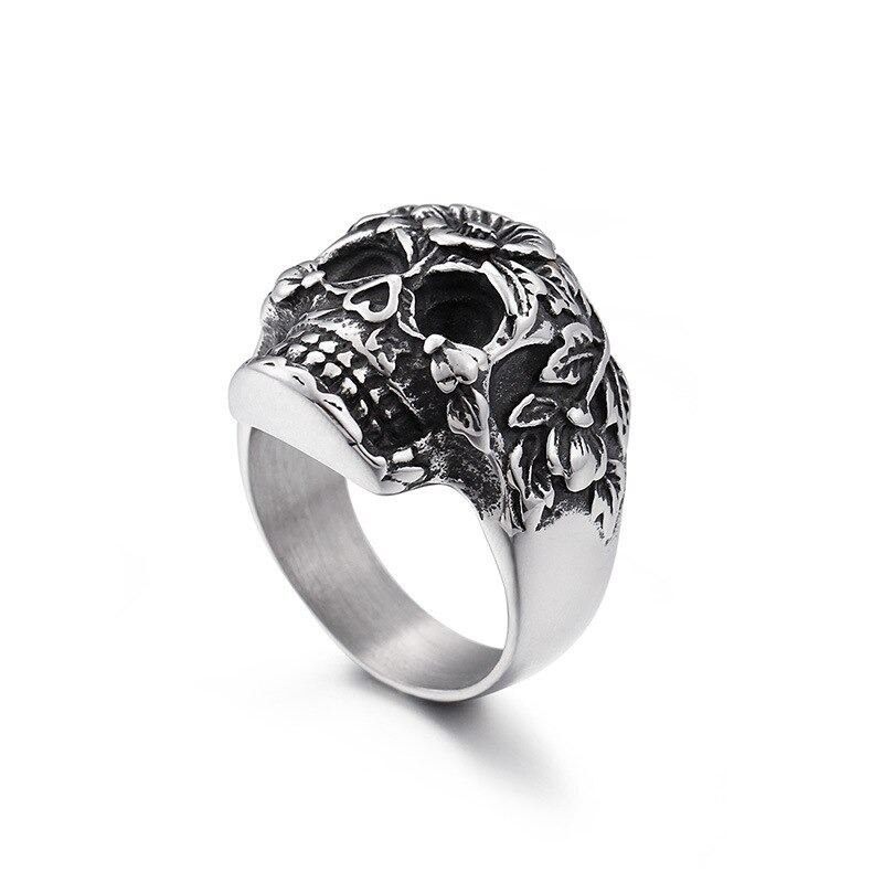 Vintage skull ring in silver stainless steel adorned with intricate flower patterns, perfect for punk rock jewelry lovers.