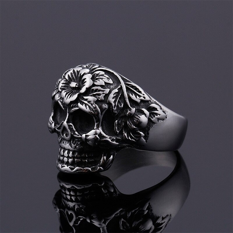 Vintage skull ring with floral patterns, crafted from silver stainless steel for women's punk jewelry collection.