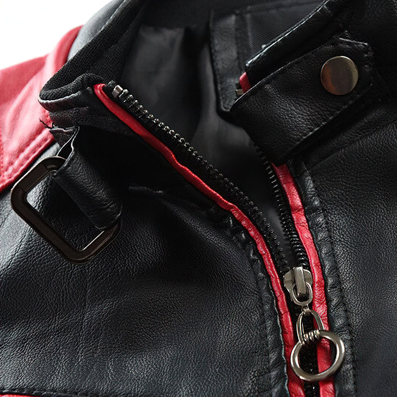 Close-up of spliced faux leather motorcycle jacket zip with black and red detailing, showcasing quality craftsmanship.