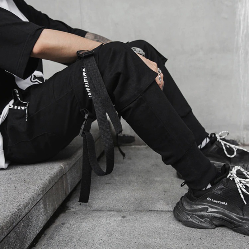 Stylish men's black cotton pants with ribbons, perfect for spring fashion and a rock style look.