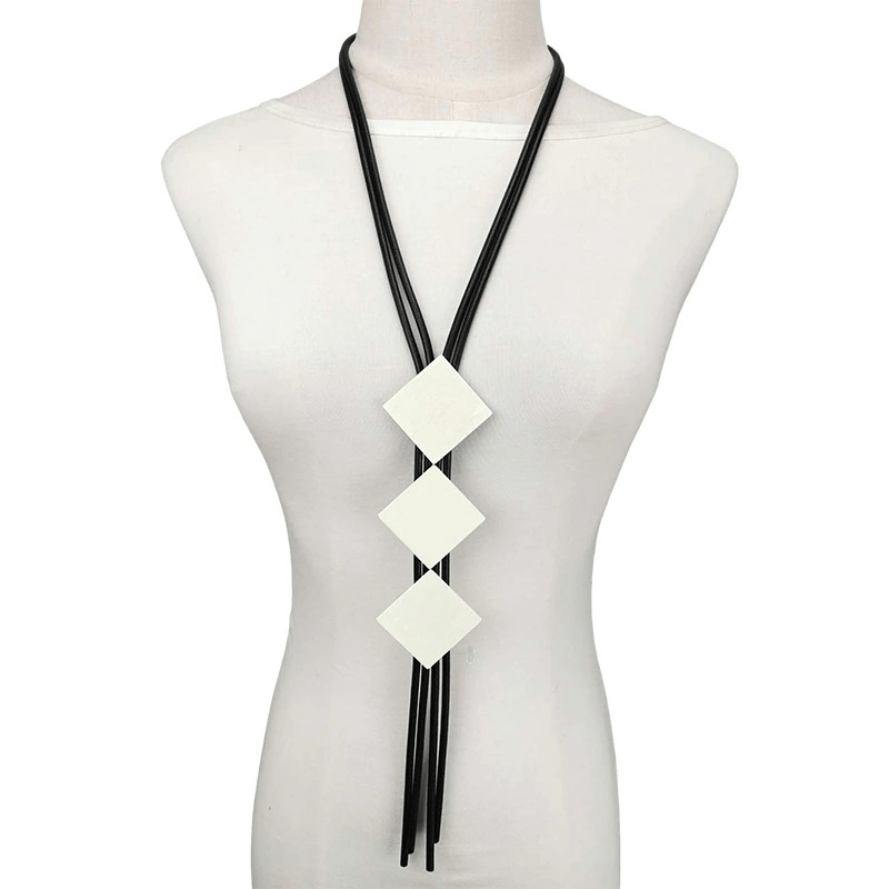 Square wood pendant necklace for women on a mannequin, stylish and casual long design with elastic rubber.
